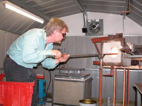 Randy heating the beer mug in the glory hole